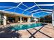 Large screened pool with patio and seating at 900 Genoa Ct, Punta Gorda, FL 33950