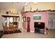 Dining room with wooden table, chandelier, and view of patio at 10 Cabello St, Punta Gorda, FL 33983