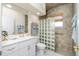 Bathroom with walk-in shower, grab bar, and modern vanity at 1014 Francesca Ct, Punta Gorda, FL 33950