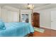 Bright bedroom with wood floors, a four-poster bed, and a large closet at 1014 Francesca Ct, Punta Gorda, FL 33950