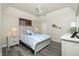 Bedroom with queen bed, ceiling fan, and dresser at 1014 Francesca Ct, Punta Gorda, FL 33950