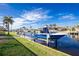 Private boat dock with a blue boat, perfect for waterfront living at 1014 Francesca Ct, Punta Gorda, FL 33950