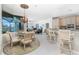 Breakfast nook with glass-top table and wicker chairs, overlooking pool at 1014 Francesca Ct, Punta Gorda, FL 33950