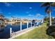 Scenic canal view with multiple homes and boats visible from the dock at 1014 Francesca Ct, Punta Gorda, FL 33950