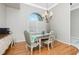 Dining room features hardwood floors, a chandelier, and window shutters at 1014 Francesca Ct, Punta Gorda, FL 33950