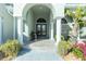 Elegant entryway with arched doorway, columns, and tiled flooring at 1014 Francesca Ct, Punta Gorda, FL 33950