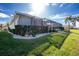 Well-maintained house exterior with lush landscaping and a screened-in patio at 1014 Francesca Ct, Punta Gorda, FL 33950