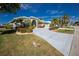 Stunning curb appeal with lush landscaping and a large driveway at 1014 Francesca Ct, Punta Gorda, FL 33950