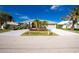 Beautiful home exterior with landscaping and a paved driveway at 1014 Francesca Ct, Punta Gorda, FL 33950
