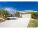 Beautiful home exterior with a large driveway and landscaped yard at 1014 Francesca Ct, Punta Gorda, FL 33950