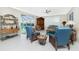 Bright Gathering room with comfy seating, pool view, and wood flooring at 1014 Francesca Ct, Punta Gorda, FL 33950