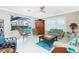 Gathering room with sliding doors opening to a lanai and pool at 1014 Francesca Ct, Punta Gorda, FL 33950