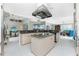 Island kitchen with granite countertops and stainless steel appliances at 1014 Francesca Ct, Punta Gorda, FL 33950