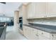 Kitchen boasts light wood cabinets and granite countertops at 1014 Francesca Ct, Punta Gorda, FL 33950