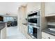 Well-equipped kitchen with double ovens and granite countertops at 1014 Francesca Ct, Punta Gorda, FL 33950
