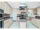 Kitchen boasts stainless steel appliances and light wood cabinets at 1014 Francesca Ct, Punta Gorda, FL 33950
