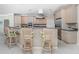 Kitchen with breakfast bar and light-colored cabinetry at 1014 Francesca Ct, Punta Gorda, FL 33950