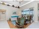 Bright and airy living room with hardwood floors and pool views at 1014 Francesca Ct, Punta Gorda, FL 33950