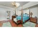 Large main bedroom with hardwood floors and ensuite bathroom access at 1014 Francesca Ct, Punta Gorda, FL 33950