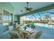 Covered patio with pool view, dining area, and seating at 1014 Francesca Ct, Punta Gorda, FL 33950