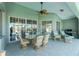 Covered patio with seating area, ceiling fan, and grill at 1014 Francesca Ct, Punta Gorda, FL 33950