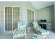 Relaxing patio with lounge chairs, side table, and grill at 1014 Francesca Ct, Punta Gorda, FL 33950