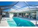 Expansive pool and lanai overlooking canal at 1014 Francesca Ct, Punta Gorda, FL 33950