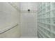 Clean shower with tiled walls, glass block accents, and grab bar at 1014 Francesca Ct, Punta Gorda, FL 33950