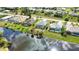 Aerial view of homes along a canal, showcasing neighborhood at 110 Albatross Rd, Rotonda West, FL 33947