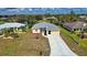 Aerial view of a single Gathering home and driveway at 110 Albatross Rd, Rotonda West, FL 33947