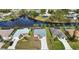 Wide aerial view of a neighborhood with houses and a canal at 110 Albatross Rd, Rotonda West, FL 33947