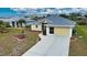 Single-Gathering house with driveway and landscaping, aerial view at 110 Albatross Rd, Rotonda West, FL 33947