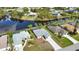 Aerial showcasing canal-front home and neighborhood at 110 Albatross Rd, Rotonda West, FL 33947