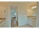 Double vanity bathroom with access to bedroom and hallway at 110 Albatross Rd, Rotonda West, FL 33947