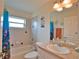 Bathroom with tub, sink and decorative nautical theme at 110 Albatross Rd, Rotonda West, FL 33947