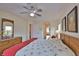 Main bedroom with king-size bed and access to bathroom at 110 Albatross Rd, Rotonda West, FL 33947