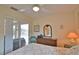 Bedroom with full-size bed and pool view at 110 Albatross Rd, Rotonda West, FL 33947