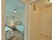 Guest bedroom with twin beds and access to hallway and bathroom at 110 Albatross Rd, Rotonda West, FL 33947