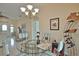 Charming dining room featuring a glass table and wine rack at 110 Albatross Rd, Rotonda West, FL 33947