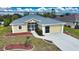 Single-story house featuring a screened porch and attached garage at 110 Albatross Rd, Rotonda West, FL 33947