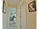 Long hallway leading to bedrooms with neutral wall tones at 110 Albatross Rd, Rotonda West, FL 33947
