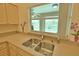 Kitchen sink and countertop with a view of the pool at 110 Albatross Rd, Rotonda West, FL 33947