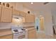 Modern kitchen with white appliances and ample counter space at 110 Albatross Rd, Rotonda West, FL 33947