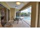 Covered lanai overlooking the pool, perfect for outdoor dining at 110 Albatross Rd, Rotonda West, FL 33947