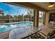 Glass-top table with chairs overlooking the pool at 110 Albatross Rd, Rotonda West, FL 33947