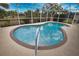 Inviting kidney-shaped pool with a screened enclosure at 110 Albatross Rd, Rotonda West, FL 33947