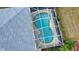 Kidney shaped pool with screened enclosure at 110 Albatross Rd, Rotonda West, FL 33947