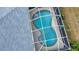 Kidney-shaped pool with screened enclosure at 110 Albatross Rd, Rotonda West, FL 33947