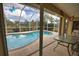 Enjoy refreshing pool and relaxing lanai with glass doors at 110 Albatross Rd, Rotonda West, FL 33947
