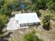 Single story home with metal roof and spacious backyard at 1136 Davis Ln, Englewood, FL 34224